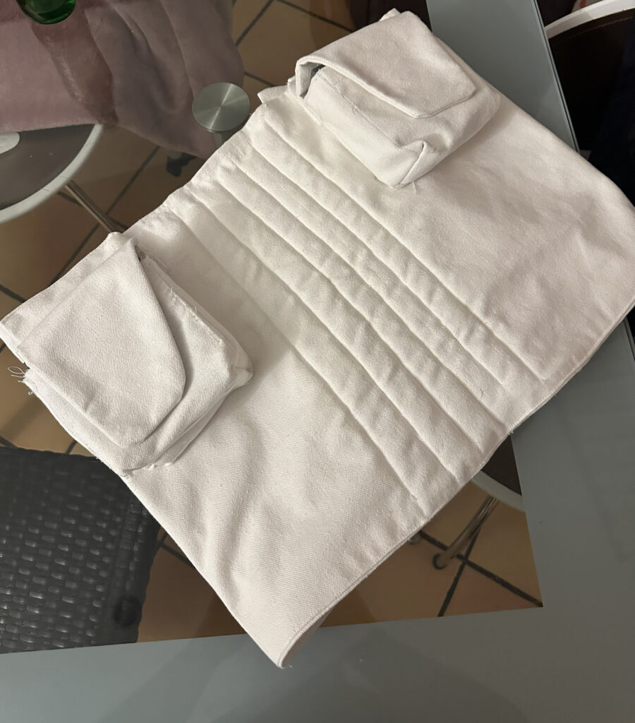 Close-up of quilted white costume fabric