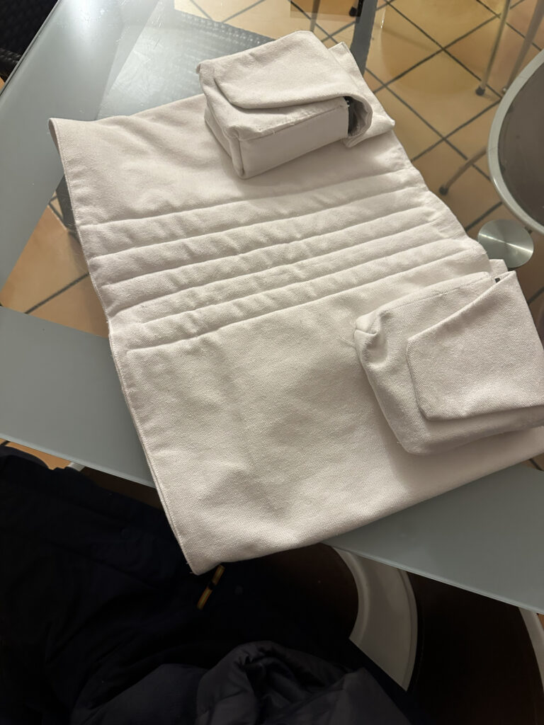White handmade costume belt with sewn pouches