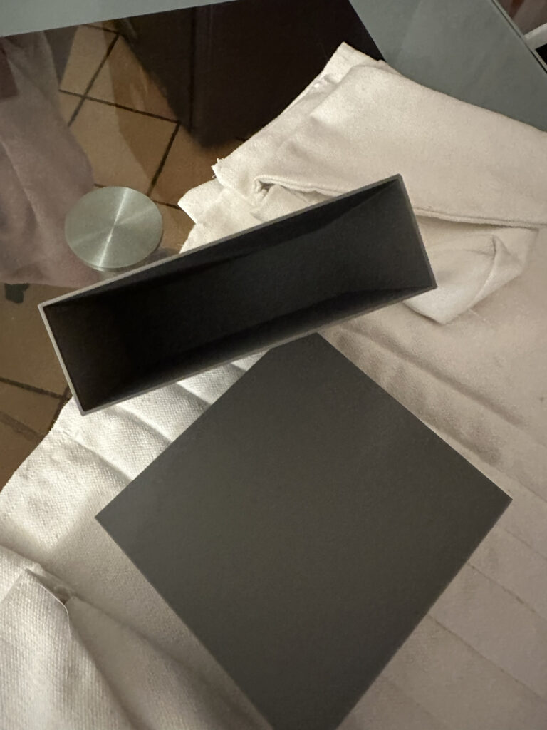 White costume garment with black panels prepared for fitting