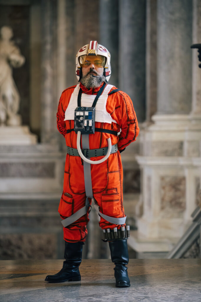 Full-length orange pilot costume with helmet and accessories