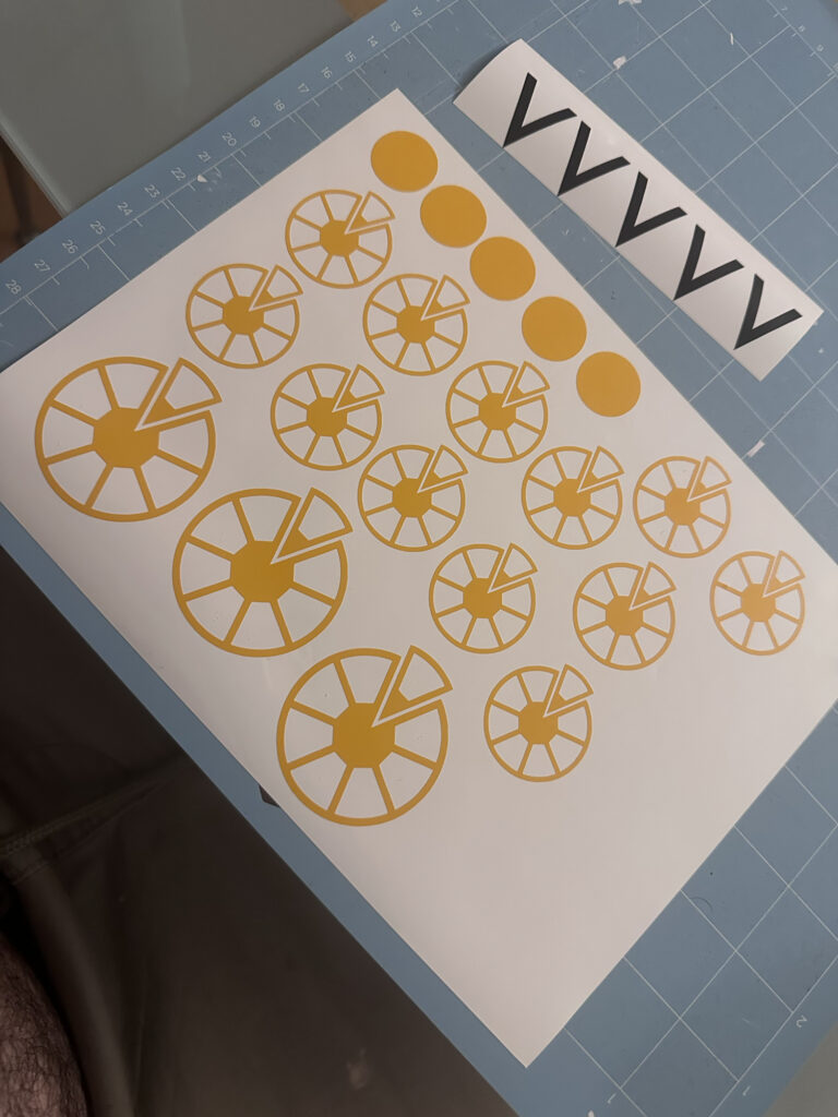 Sheet of yellow circular decals ready for cutting