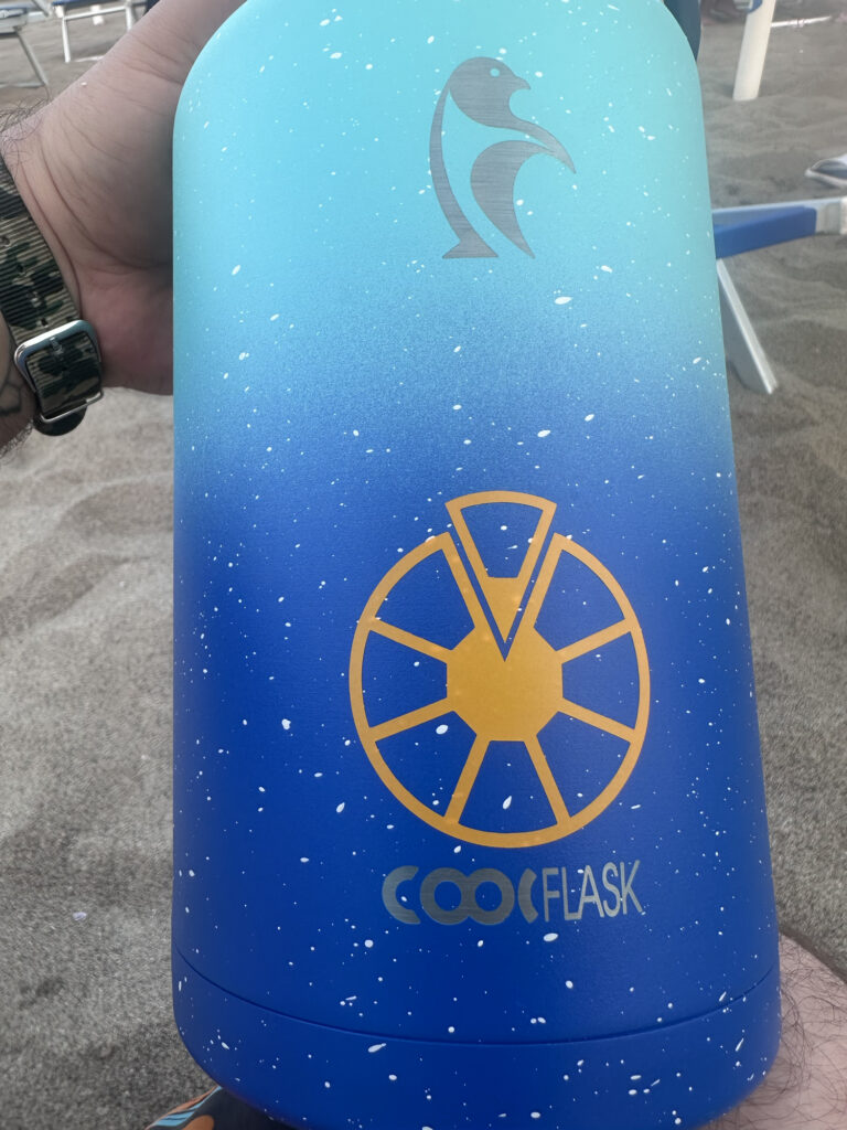 Blue custom bottle with yellow emblem and lettering