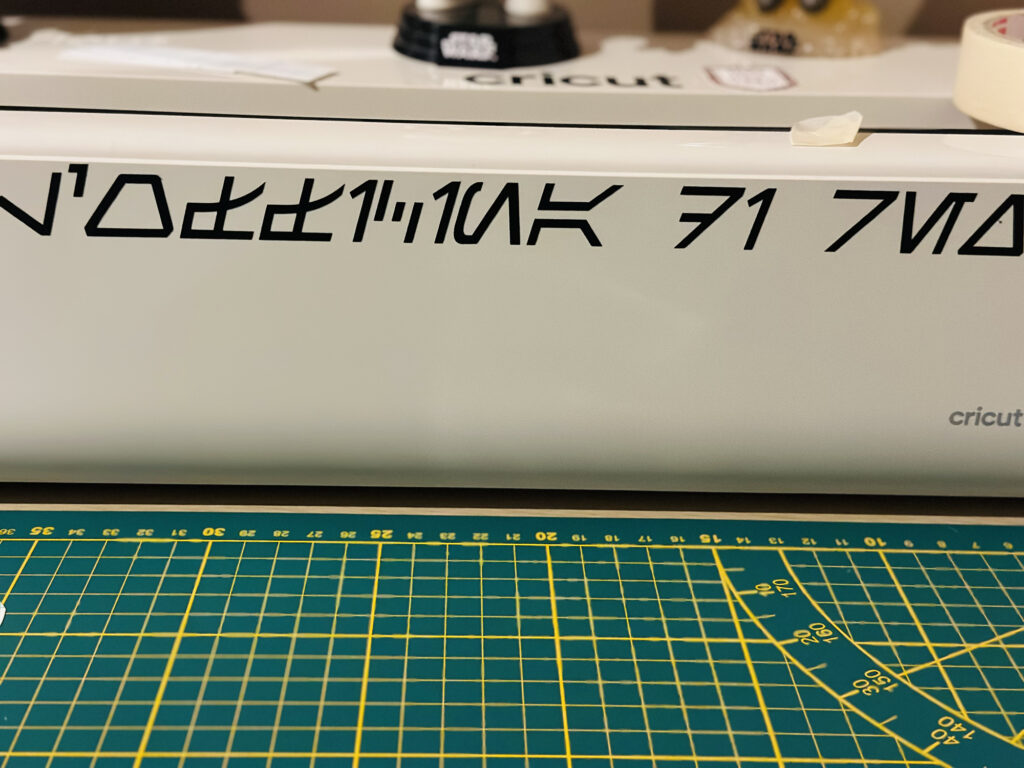 Black lettering decal applied to a white surface