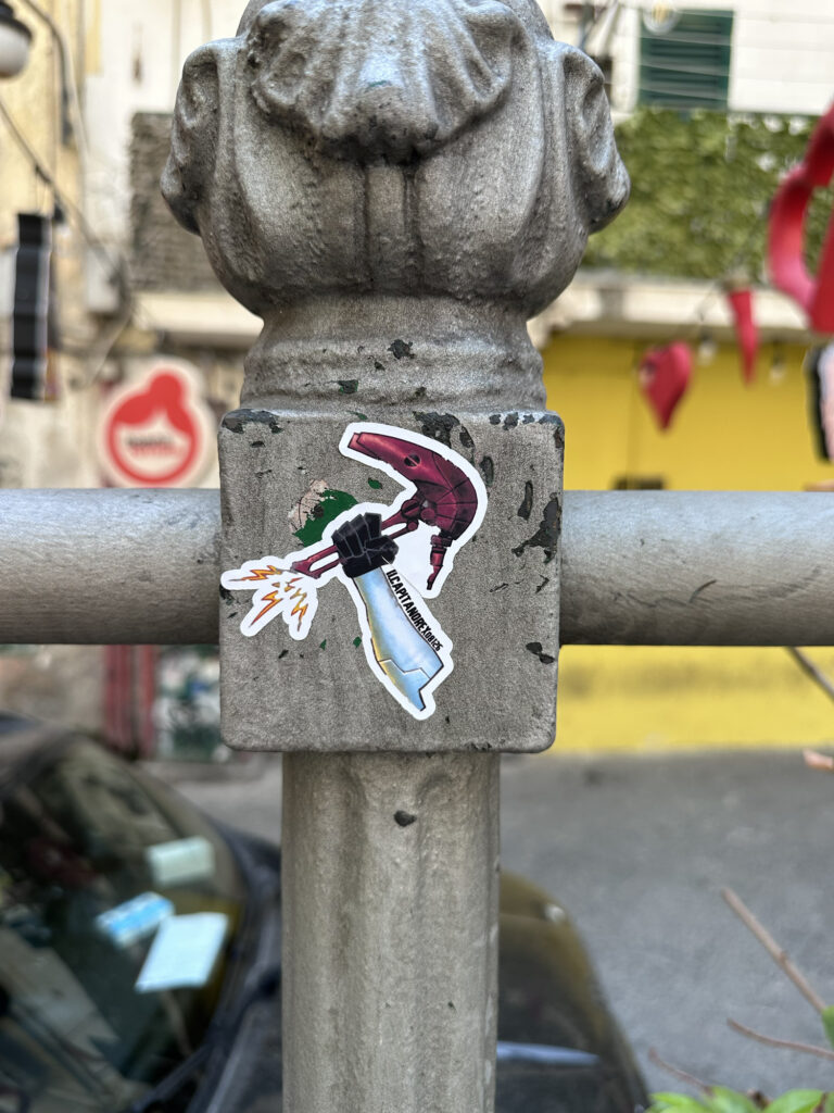 Colorful character sticker applied to an outdoor post