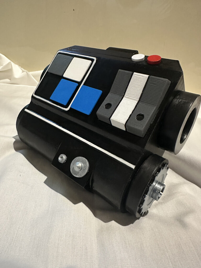 Black and blue sci-fi control panel prop with silver controls
