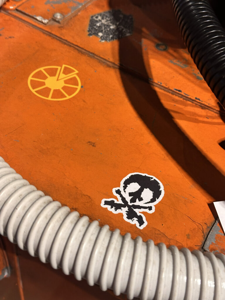 Yellow custom decal on the side of an orange crate