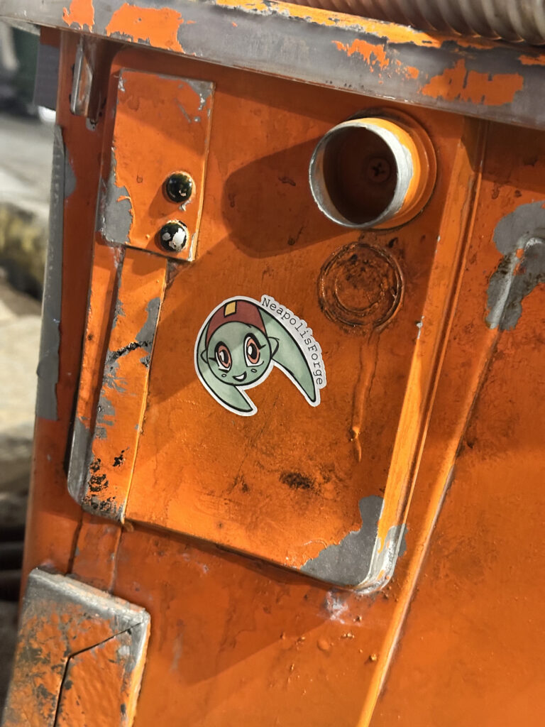 Small printed sticker on an orange prop crate
