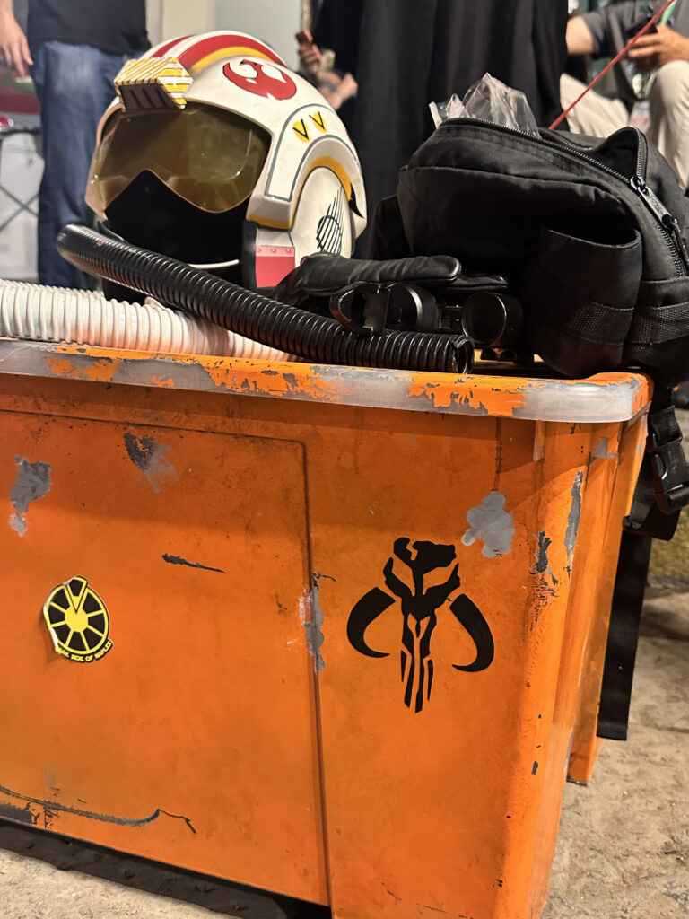 Custom decals on an orange sci-fi prop crate