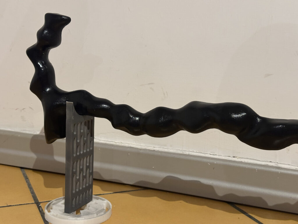 Close-up of the twisted handle of a black staff prop