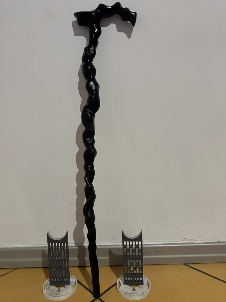 Full-length black fantasy staff prop with display supports