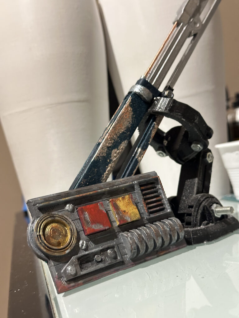 Close-up of a weathered sci-fi prop with metallic details