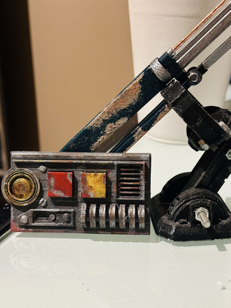 Weathered sci-fi prop with red and yellow control details